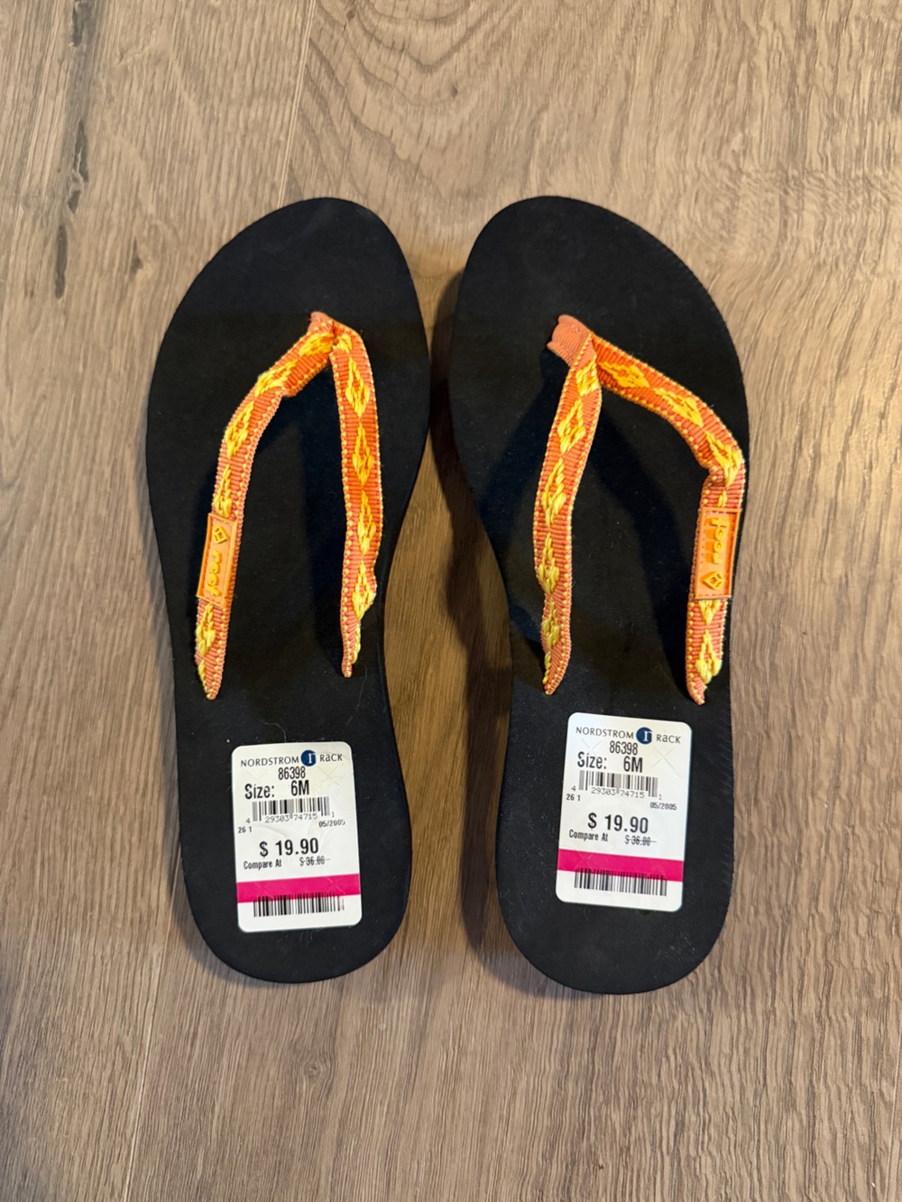 Reef Black Flip Flops with Orange and Yellow Woven Straps